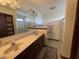 Bathroom with double sinks, shower, and linen closet at 1144 Woodridge, Brownsburg, IN 46112