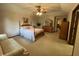 Spacious bedroom with a large bed, sitting area and ample closet space at 1144 Woodridge, Brownsburg, IN 46112