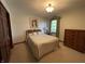 Cozy bedroom with double bed, dresser, and window at 1144 Woodridge, Brownsburg, IN 46112