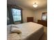 Cozy bedroom with a queen bed and dresser at 1144 Woodridge, Brownsburg, IN 46112