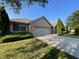 Brick ranch home with 2-car garage and well-manicured lawn at 1144 Woodridge, Brownsburg, IN 46112
