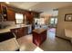 Updated kitchen with stainless steel appliances and view to sunroom at 1144 Woodridge, Brownsburg, IN 46112
