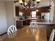 Modern kitchen with stainless steel appliances and wood cabinets at 1144 Woodridge, Brownsburg, IN 46112
