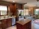 Updated kitchen with stainless steel appliances and view to sunroom at 1144 Woodridge, Brownsburg, IN 46112
