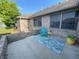 Relaxing patio with brick wall, seating, and water view at 1144 Woodridge, Brownsburg, IN 46112