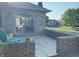 Private patio with brick wall, seating, and water view at 1144 Woodridge, Brownsburg, IN 46112