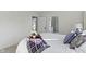 A bedroom view into a bathroom with white fixtures and a glass shower at 2936 N New Jersey St, Indianapolis, IN 46205