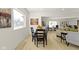 Open-concept dining area flowing into the living room, with hardwood floors and a large window at 2936 N New Jersey St, Indianapolis, IN 46205