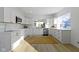 Modern kitchen with stainless steel appliances, white cabinets, and natural light from the window at 2936 N New Jersey St, Indianapolis, IN 46205