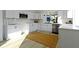 Modern white kitchen featuring stainless steel appliances, a tile backsplash, and plenty of cabinet space at 2936 N New Jersey St, Indianapolis, IN 46205
