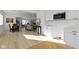 Open-concept layout showcasing the kitchen, dining area, and living room, with hardwood floors at 2936 N New Jersey St, Indianapolis, IN 46205