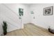 Bright hallway featuring neutral walls, luxury vinyl plank flooring, white trim and natural lighting at 3031 N New Jersey St, Indianapolis, IN 46205