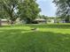 Spacious backyard with a fire pit and plenty of room for entertaining and recreation at 105 Tulip Dr, Indianapolis, IN 46227