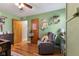 Bedroom offering a chair, wooden floors, and a closet at 105 Tulip Dr, Indianapolis, IN 46227