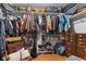 Walk-in closet displaying clothes on hanging racks, drawers, and storage on top shelves at 105 Tulip Dr, Indianapolis, IN 46227