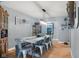 Bright dining room featuring a dining table with metal chairs, hardwood floors, and stylish decor at 105 Tulip Dr, Indianapolis, IN 46227