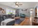 Cozy living room featuring hardwood floors, a comfortable sectional sofa, and lots of natural light at 105 Tulip Dr, Indianapolis, IN 46227