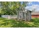 Backyard shed with a white picket fence, offering plenty of storage space at 105 Tulip Dr, Indianapolis, IN 46227