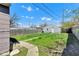 Backyard area featuring a detached garage and a wooden privacy fence at 2137 Ringgold Ave, Indianapolis, IN 46203