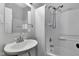 This bathroom features a sink, toilet, shower with white tile and modern fixtures at 2137 Ringgold Ave, Indianapolis, IN 46203