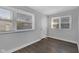 Bedroom with vinyl flooring, natural light, and closet space at 2137 Ringgold Ave, Indianapolis, IN 46203