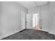Carpeted bedroom with classic doors leading to other rooms at 2137 Ringgold Ave, Indianapolis, IN 46203