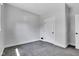 A cozy bedroom with carpeted floors, complemented by a classic paneled door at 2137 Ringgold Ave, Indianapolis, IN 46203