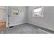 Bright carpeted bedroom with two windows offering natural light at 2137 Ringgold Ave, Indianapolis, IN 46203