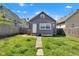 Charming single-Gathering home features a welcoming facade, neat landscaping, and a well-manicured lawn at 2137 Ringgold Ave, Indianapolis, IN 46203