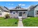 Charming bungalow-style home with a welcoming front porch and well-maintained lawn at 2137 Ringgold Ave, Indianapolis, IN 46203