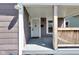 Inviting front porch with white columns and a view of the front door at 2137 Ringgold Ave, Indianapolis, IN 46203
