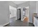 Hallway connecting different rooms with vinyl flooring and freshly painted walls at 2137 Ringgold Ave, Indianapolis, IN 46203