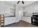 Charming kitchen with white cabinets, stainless steel sink, and dark countertops at 2137 Ringgold Ave, Indianapolis, IN 46203