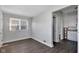 Bright living room with vinyl flooring and views into the kitchen at 2137 Ringgold Ave, Indianapolis, IN 46203