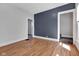 Hardwood floors accent the living room, leading to carpeted stairs at 2137 Ringgold Ave, Indianapolis, IN 46203