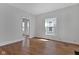 Bright living room with hardwood floors, neutral walls, and lots of natural light at 2137 Ringgold Ave, Indianapolis, IN 46203