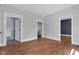 Spacious living room with hardwood floors and neutral paint, offering a versatile space at 2137 Ringgold Ave, Indianapolis, IN 46203
