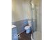 Bathroom with shower, toilet, and gray tile at 902 W Main St, Greenfield, IN 46140