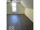 Large bedroom with window and ceiling fan at 902 W Main St, Greenfield, IN 46140