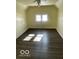 Charming bedroom with two windows and ceiling fan at 902 W Main St, Greenfield, IN 46140
