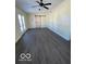 Spacious bedroom with barn door and dark gray flooring at 902 W Main St, Greenfield, IN 46140