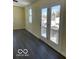 Bright bedroom with French doors leading to a balcony at 902 W Main St, Greenfield, IN 46140