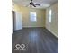 Spacious bedroom with new flooring and ceiling fan at 902 W Main St, Greenfield, IN 46140