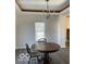 Elegant dining area with chandelier and wood table at 902 W Main St, Greenfield, IN 46140