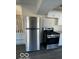 Stainless steel refrigerator and gas range in the kitchen at 902 W Main St, Greenfield, IN 46140