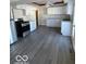 Kitchen with white cabinets and gray vinyl flooring at 902 W Main St, Greenfield, IN 46140