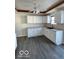 Newly remodeled kitchen with white cabinets and gray flooring at 902 W Main St, Greenfield, IN 46140