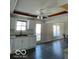 Bright kitchen with white cabinets, new flooring, and access to deck at 902 W Main St, Greenfield, IN 46140