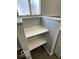 Laundry room with white shelves and gray walls at 902 W Main St, Greenfield, IN 46140