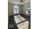 Bright living room with hardwood floors and an arched window at 902 W Main St, Greenfield, IN 46140